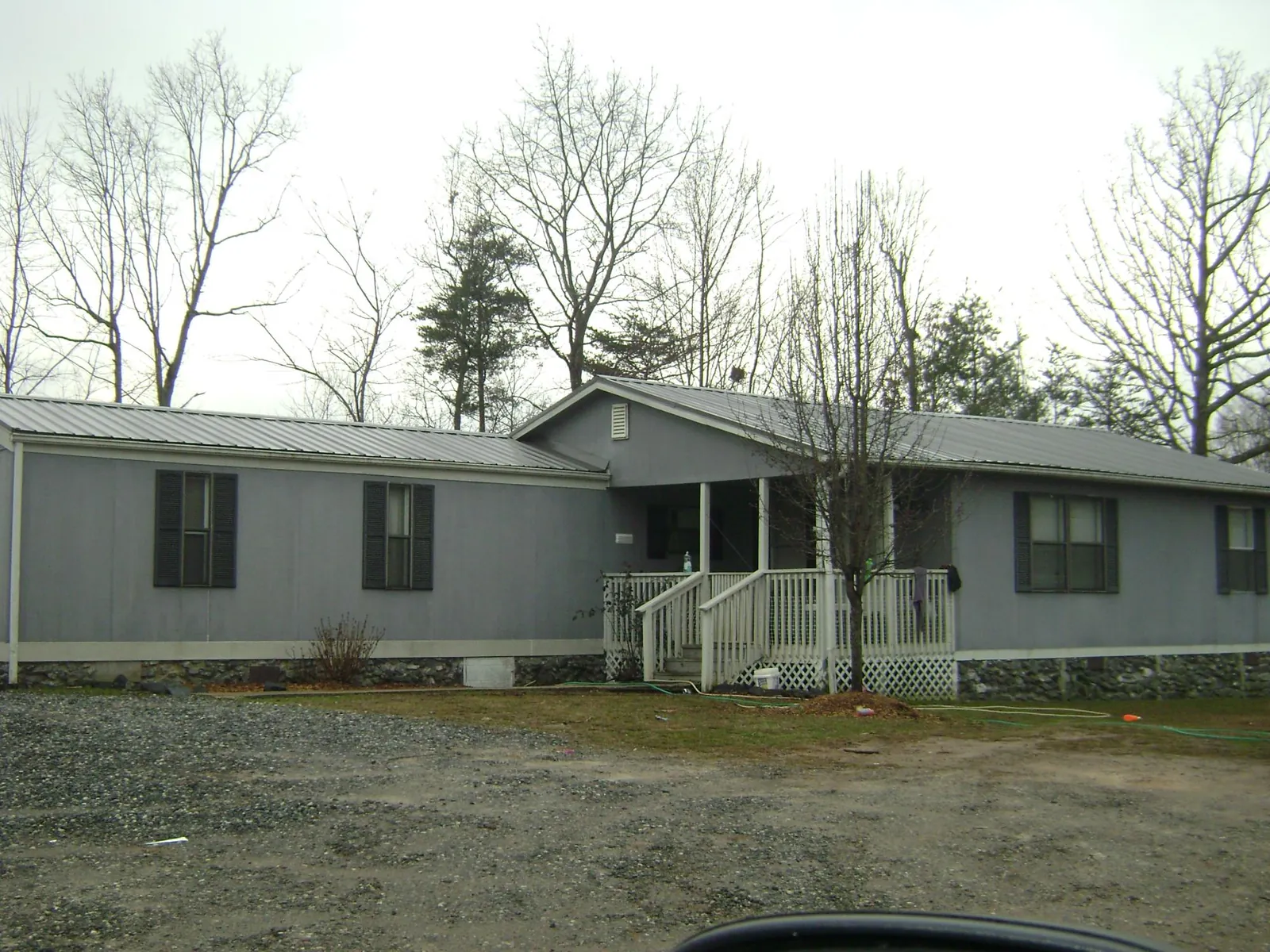 Metal roof over a manufactured home with a covered front porch in Whites Creek